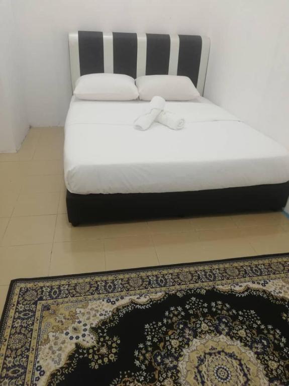 Postel nebo postele na pokoji v ubytování RIYAD HOTEL