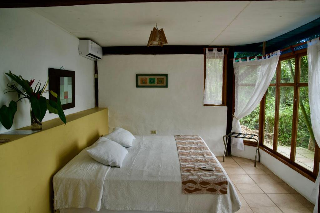 Postel nebo postele na pokoji v ubytování Samai Lodge Holistic Living
