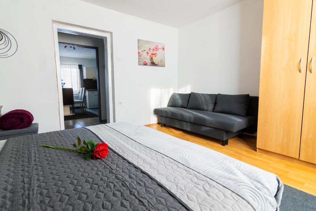 Postel nebo postele na pokoji v ubytování Apartma Ella