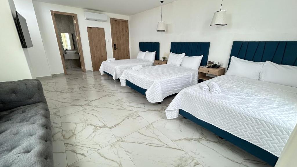 Postel nebo postele na pokoji v ubytování Hotel Presidente Beach Playas