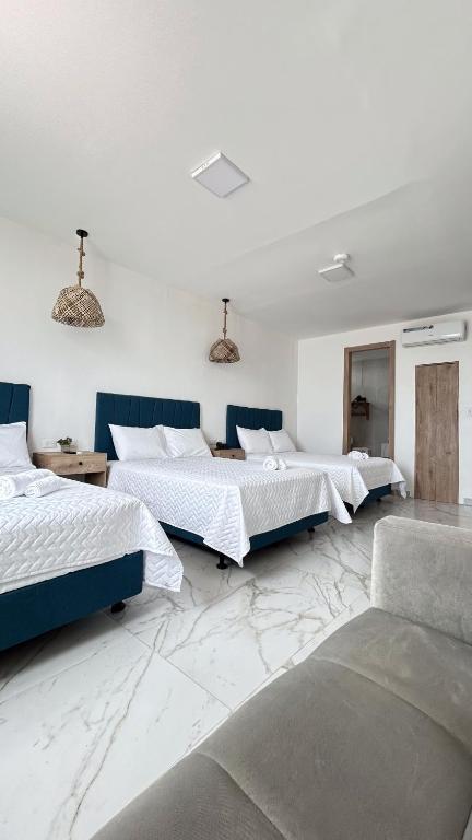 Postel nebo postele na pokoji v ubytování Hotel Presidente Beach Playas