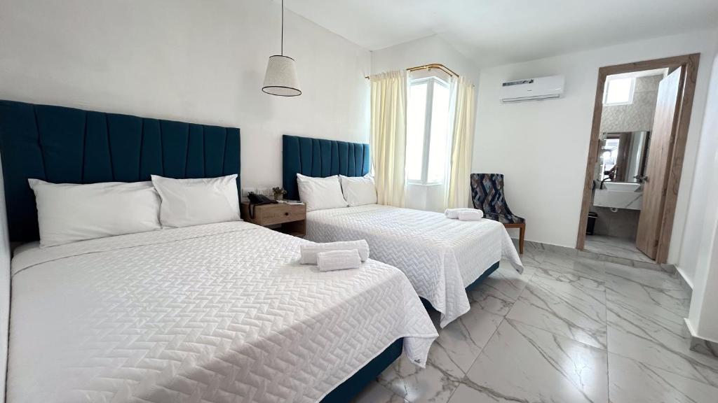 Postel nebo postele na pokoji v ubytování Hotel Presidente Beach Playas