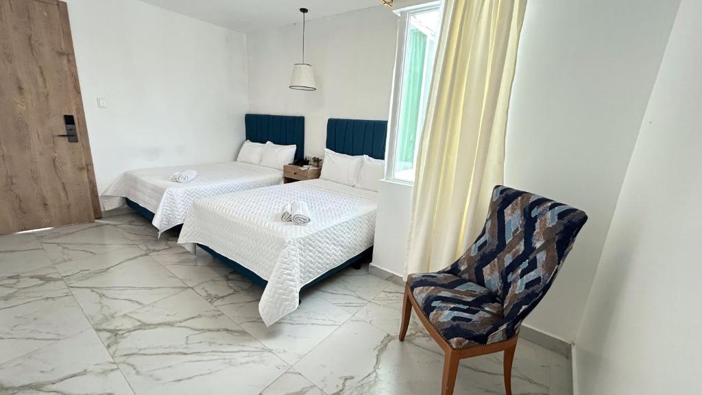 Postel nebo postele na pokoji v ubytování Hotel Presidente Beach Playas