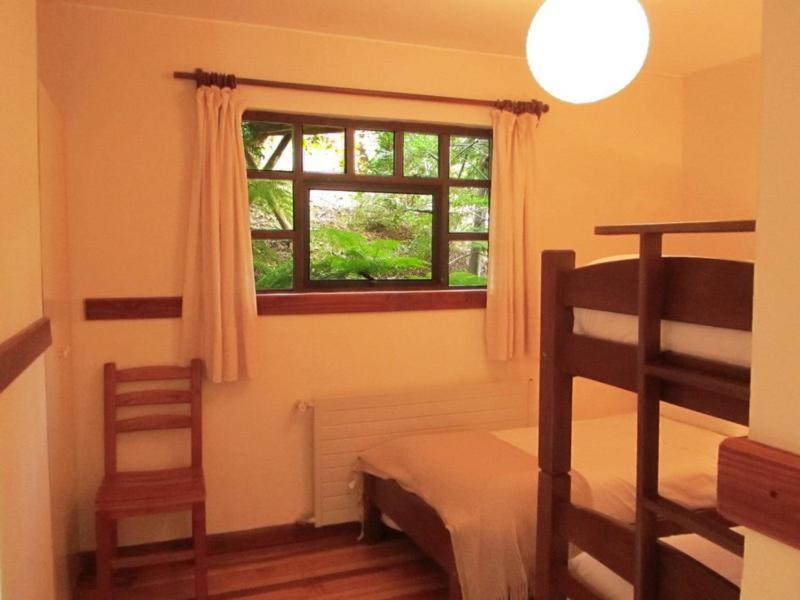 Letto o letti in una camera di Cabañas Portal Pucon
