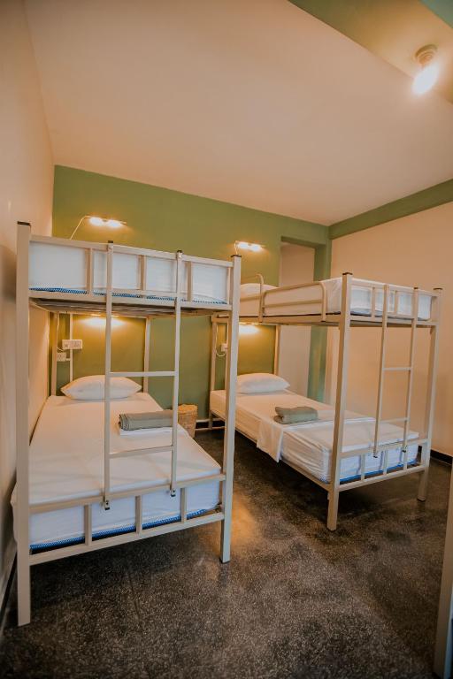 Postel nebo postele na pokoji v ubytování Drop Inn Hostels
