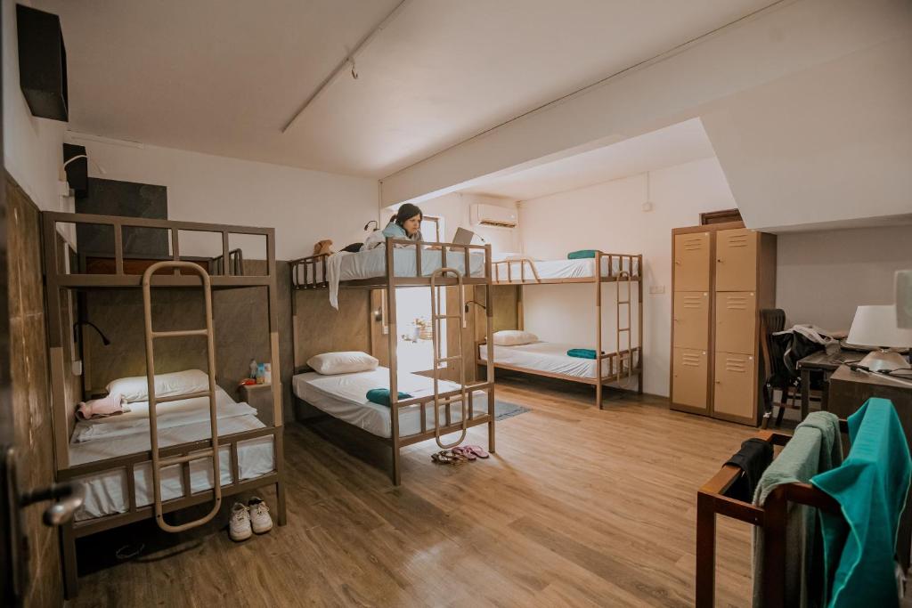 Postel nebo postele na pokoji v ubytování Drop Inn Hostels