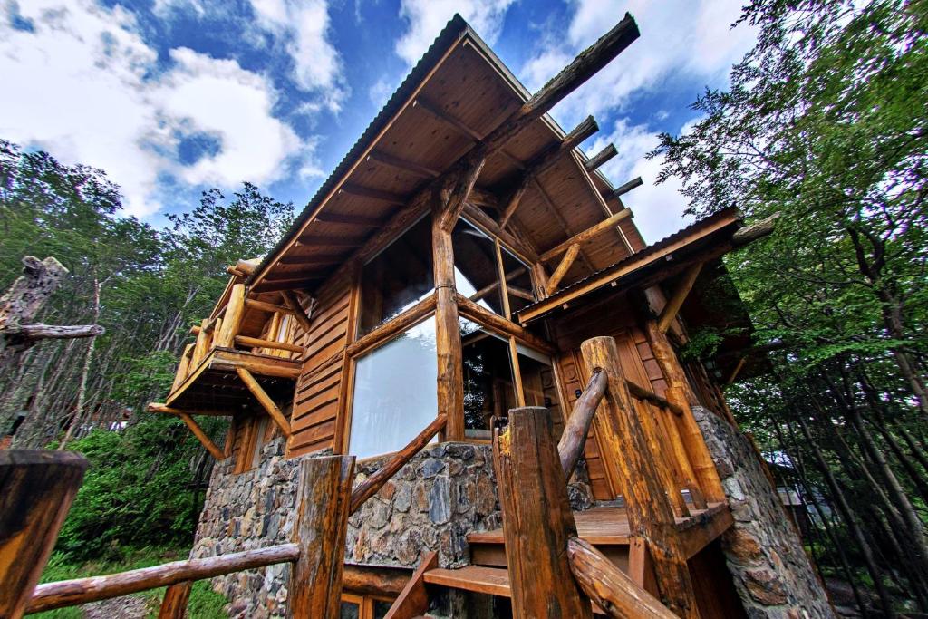 a tree house in the middle of a forest at Patagonia Villa Lodge in Ushuaia