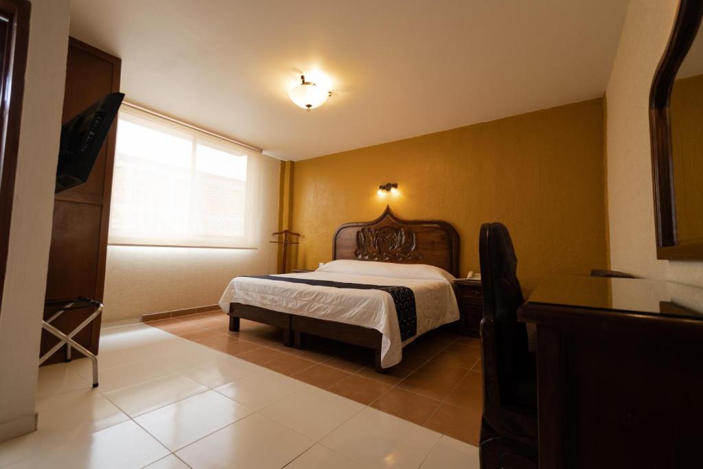 Postel nebo postele na pokoji v ubytování Hotel HC
