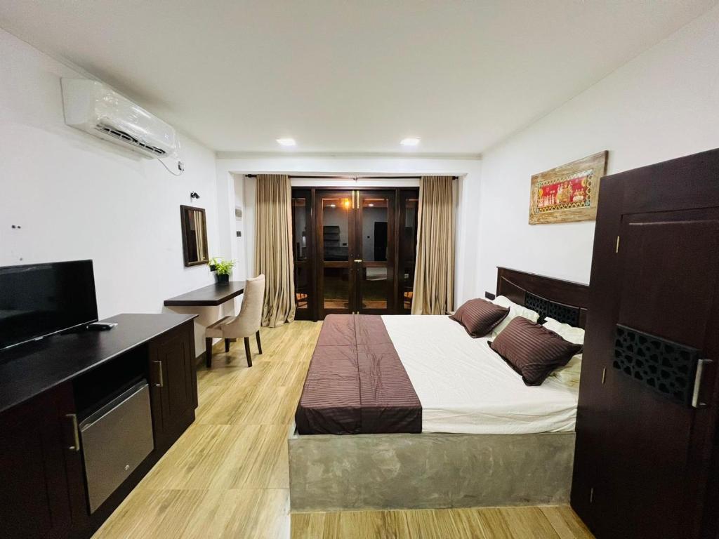 Ένα ή περισσότερα κρεβάτια σε δωμάτιο στο Bunty Residence Ambalangoda