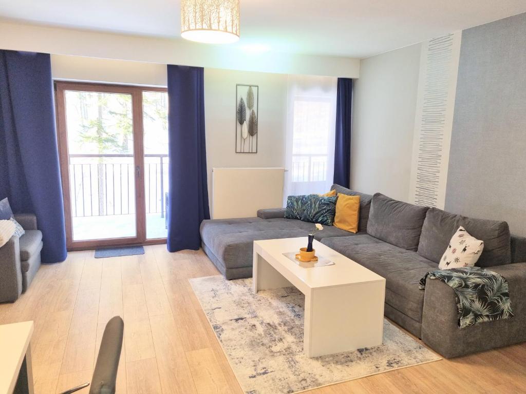Posedenie v ubytovaní Apartament z pięknym widokiem na las