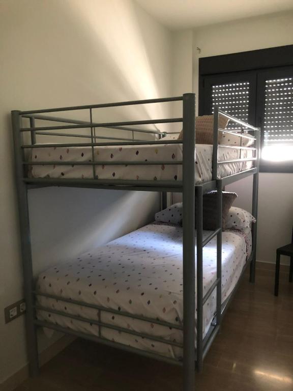 A bed or beds in a room at Apartamento Migdia-Moraira