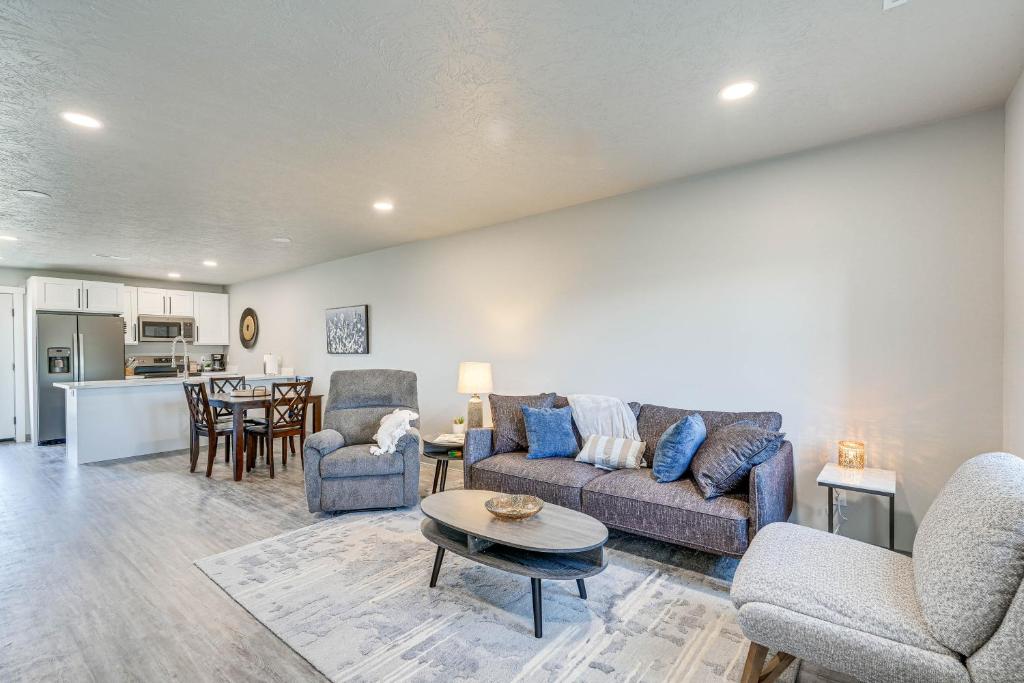 a living room with a couch and chairs and a table at Convenient Great Falls Condo Less Than 1 Mi to Shops! in Great Falls