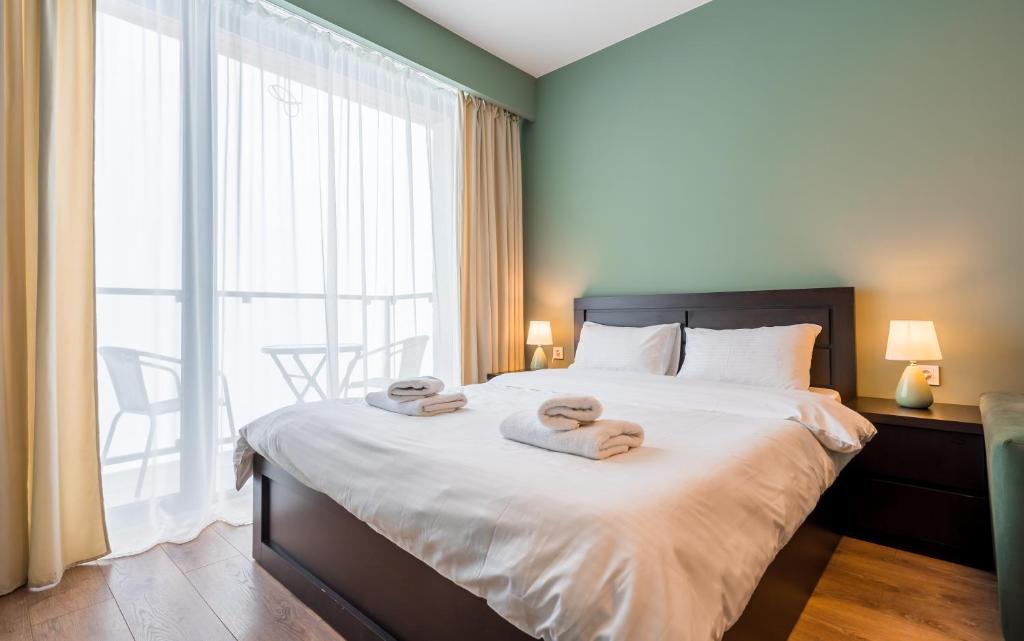 Postel nebo postele na pokoji v ubytování Studio Apartment NFT New Gudauri 503