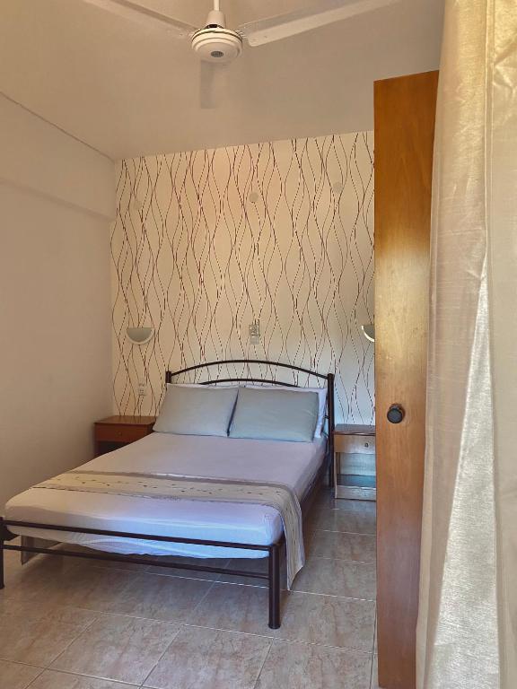 Postel nebo postele na pokoji v ubytování Possidi Kouslaka