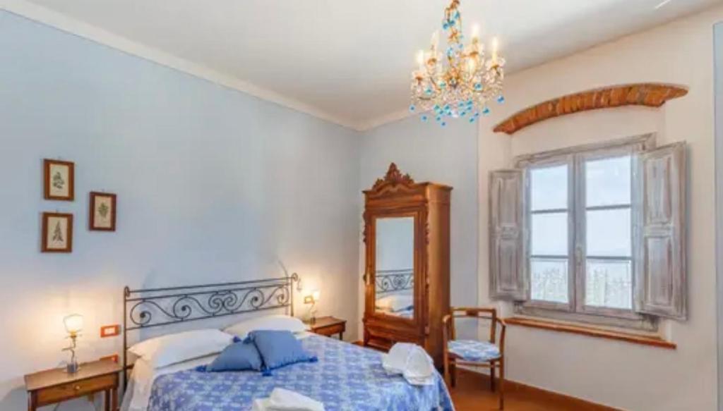 A bed or beds in a room at Agriturismo Poggio Tondo