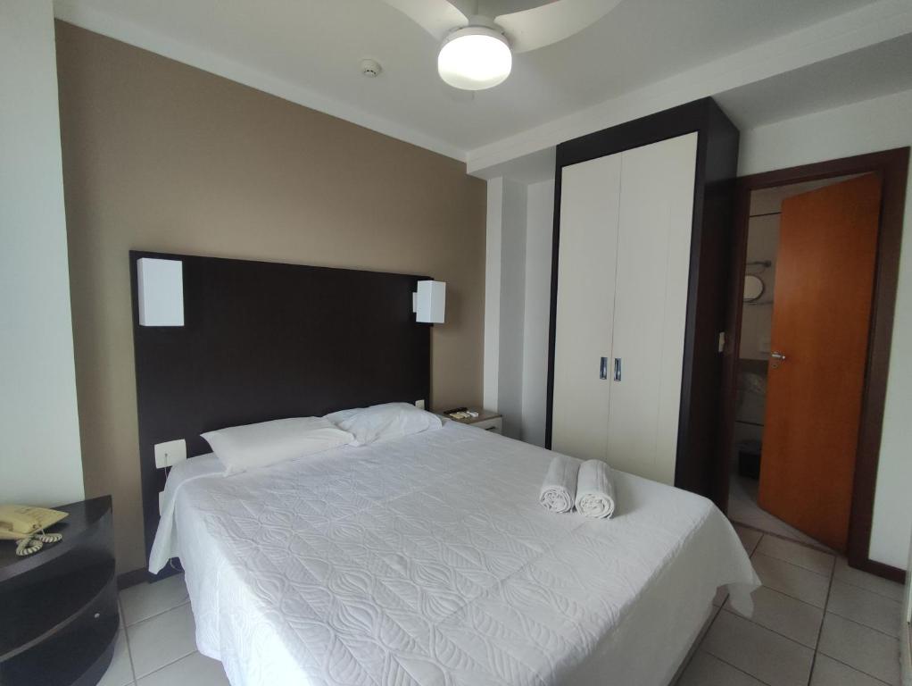 מיטה או מיטות בחדר ב-Flat 805 Triângulo Apart