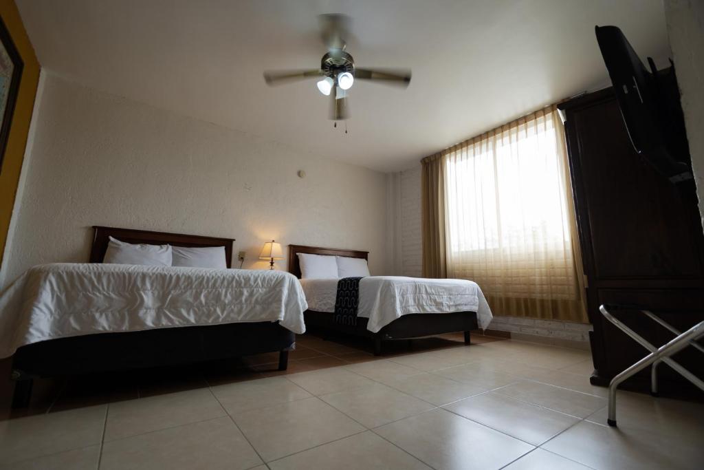Postel nebo postele na pokoji v ubytování Hotel HC