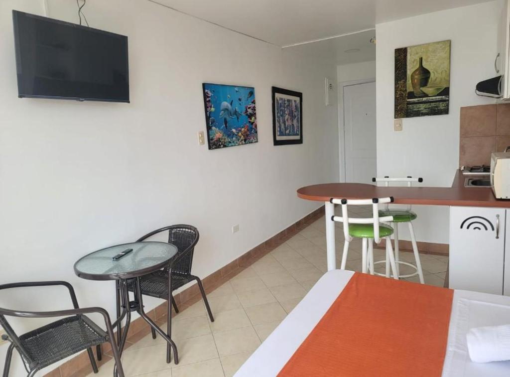 TV a/nebo společenská místnost v ubytování Hotel Arco Iris