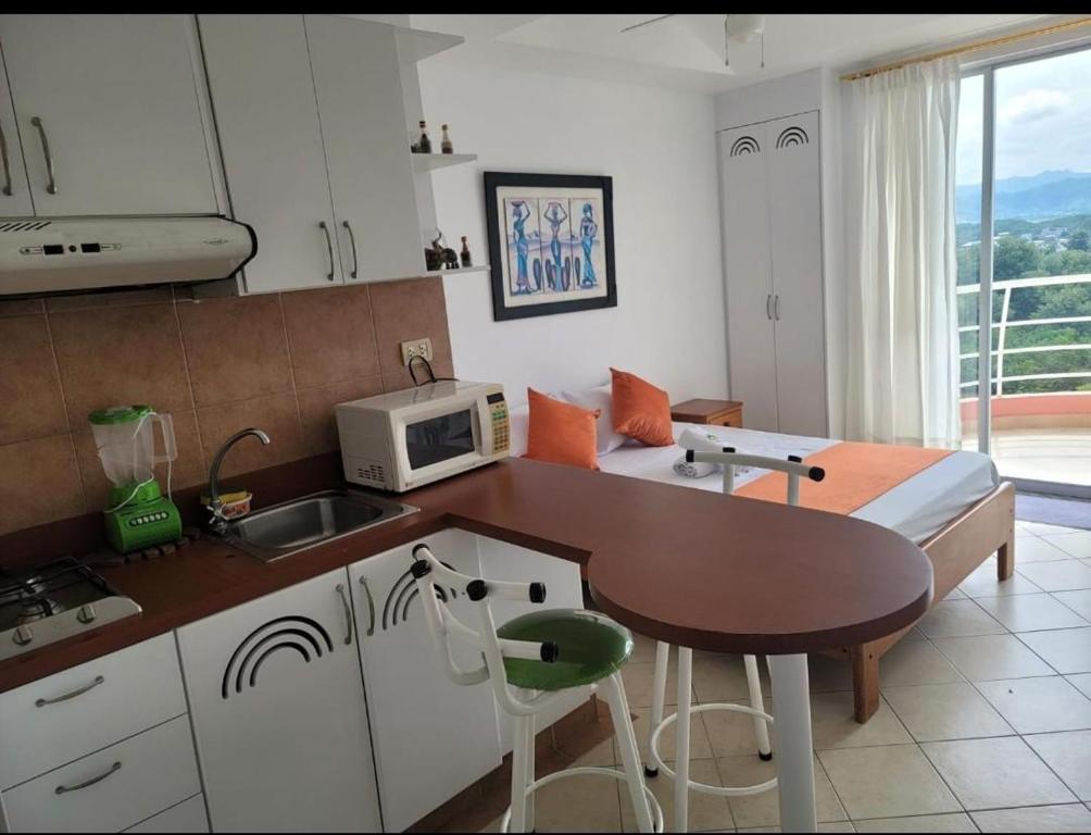 Kuchyň nebo kuchyňský kout v ubytování Hotel Arco Iris