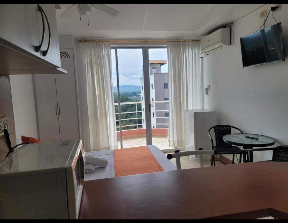 TV a/nebo společenská místnost v ubytování Hotel Arco Iris