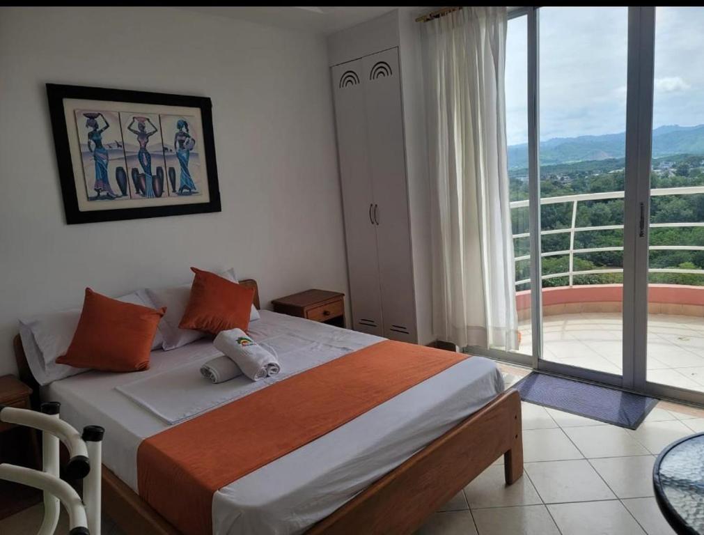 Postel nebo postele na pokoji v ubytování Hotel Arco Iris