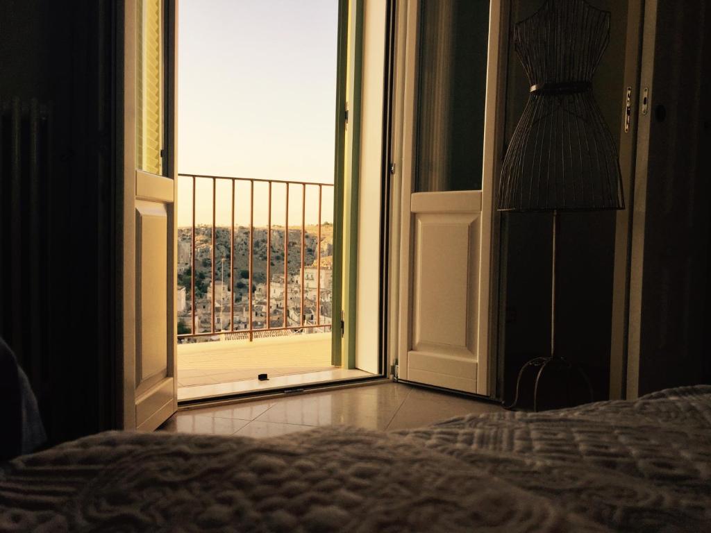 Postel nebo postele na pokoji v ubytování L'Incanto Luxury Rooms