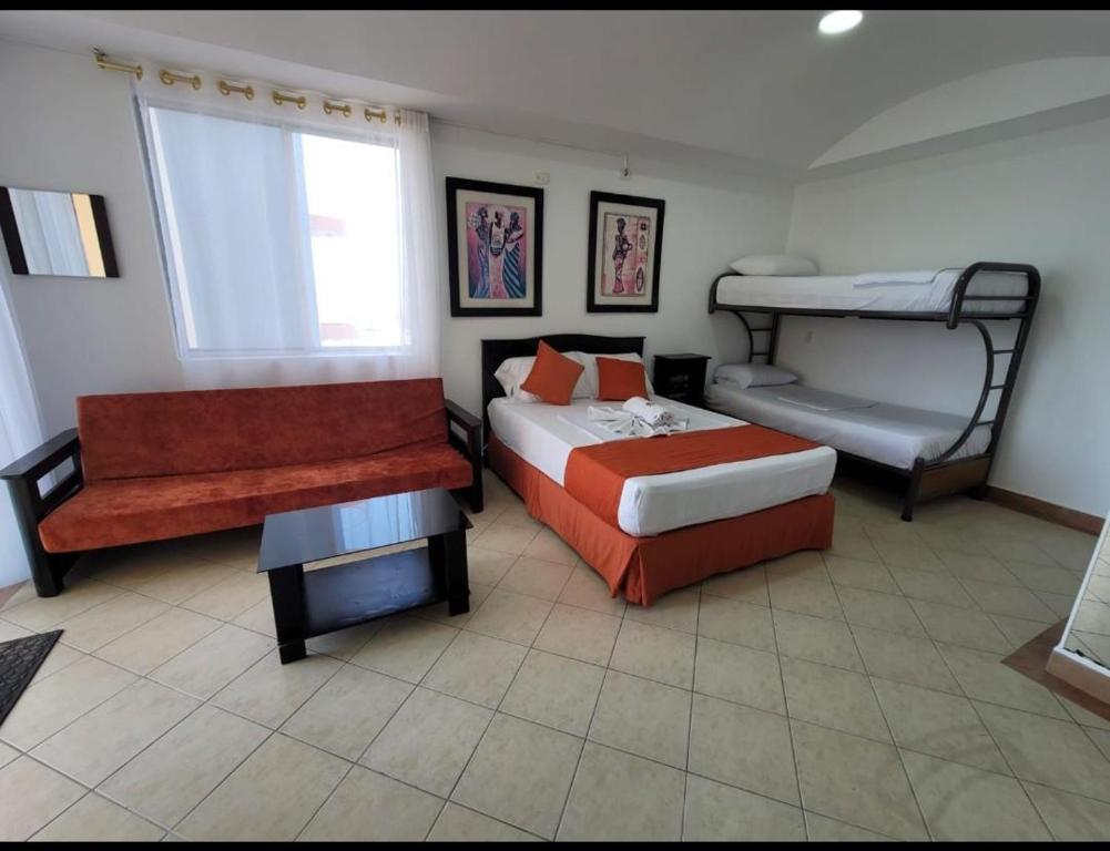 Postel nebo postele na pokoji v ubytování Hotel Arco Iris