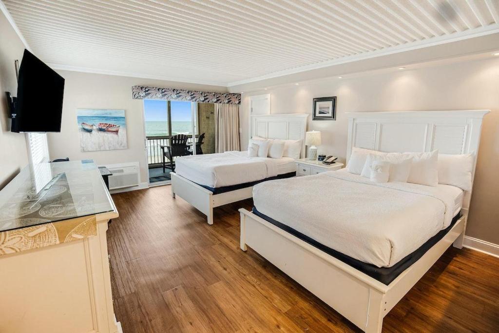 Ένα ή περισσότερα κρεβάτια σε δωμάτιο στο Quintessential Beach Retreat 2nd Flr