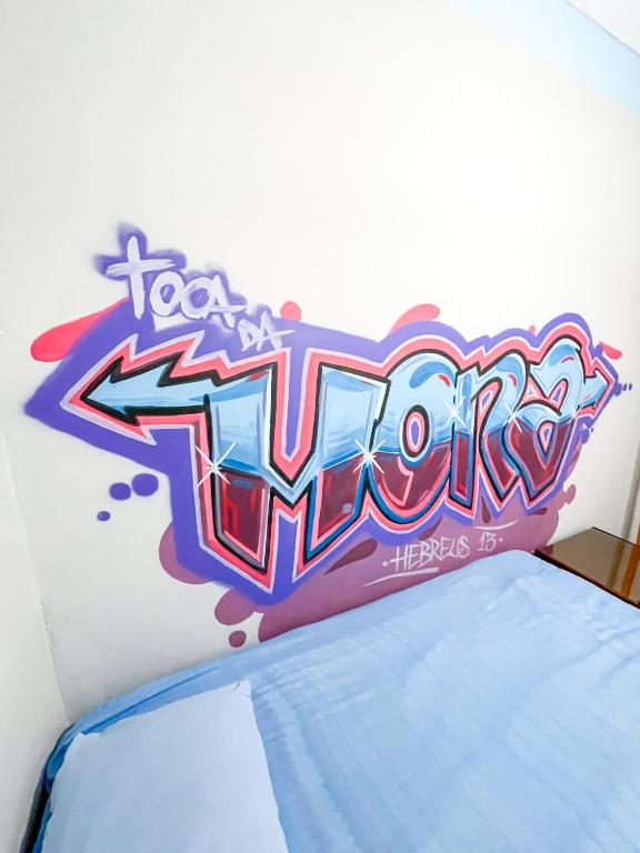Postel nebo postele na pokoji v ubytování Toca da Mona Roots Hostel