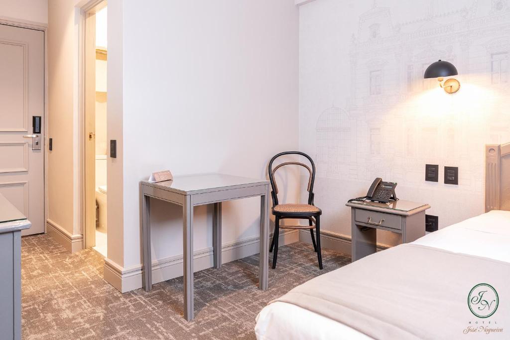 Postel nebo postele na pokoji v ubytování Hotel José Nogueira