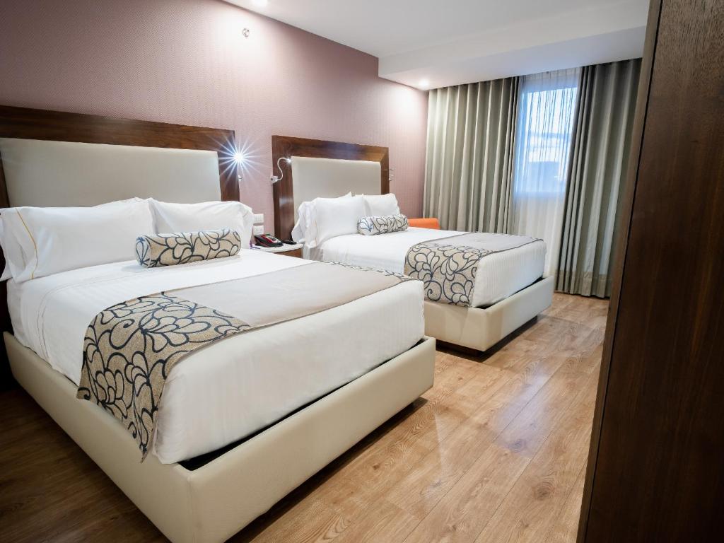 Postel nebo postele na pokoji v ubytování HS HOTSSON Hotel Queretaro