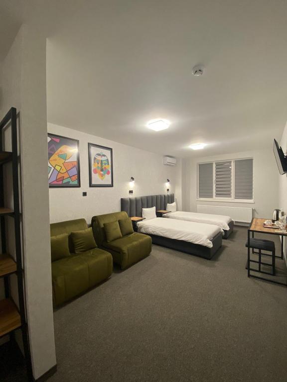 Postel nebo postele na pokoji v ubytování VATRA HOTEL