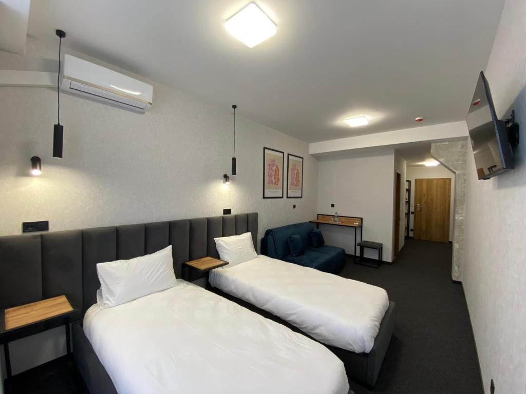 Postel nebo postele na pokoji v ubytování VATRA HOTEL
