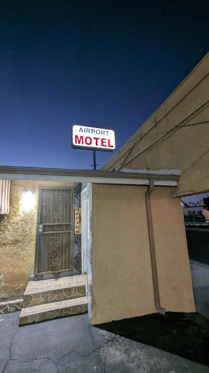 a sign for an autograph motel on top of a building at Airport Motel - Inglewood in Inglewood
