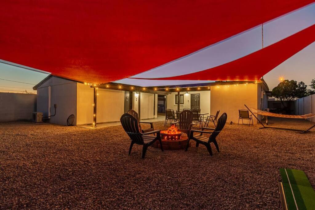 a group of chairs and a table under a tent at Phoenix Retreat - 2 Bedroom Home with King-Size Bed - 3 Smart TVs - 10 min from Airp - Unit A in Phoenix