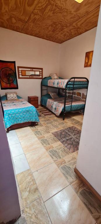 Postel nebo postele na pokoji v ubytování Hostal Likancabur