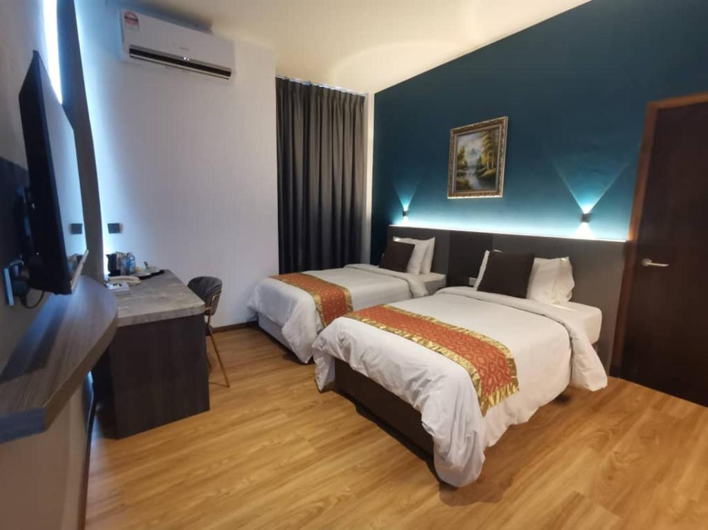 Postel nebo postele na pokoji v ubytování Sentral View Hotel Bintulu