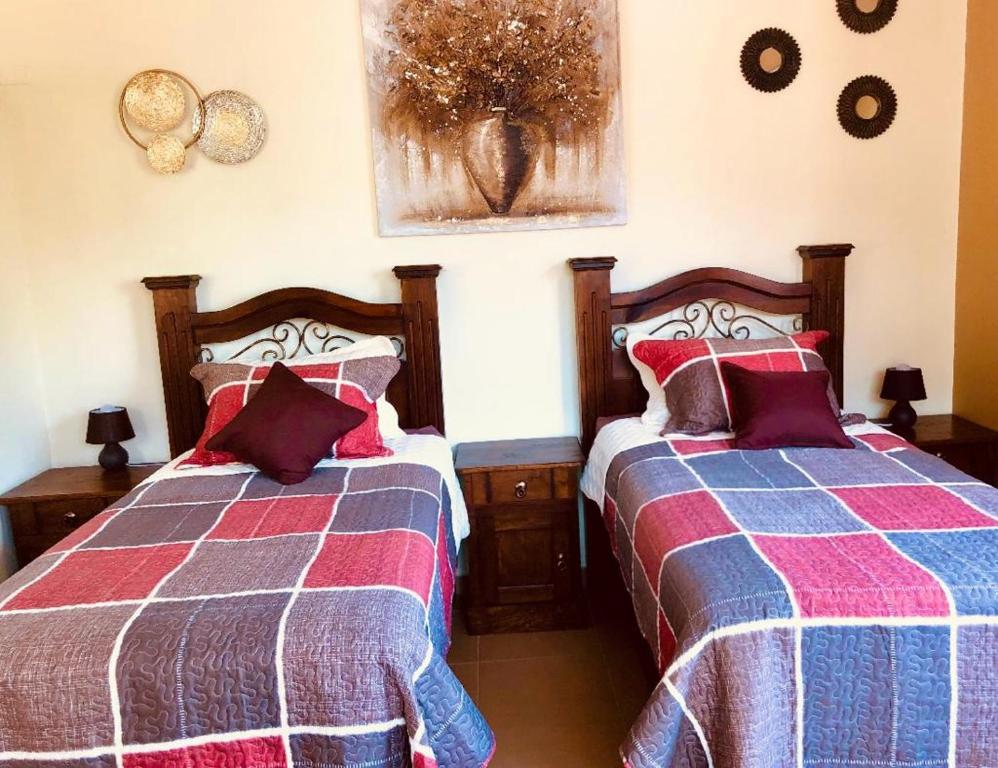 Un pat sau paturi într-o cameră la Mayan Plaza B&B Habitación Independiente