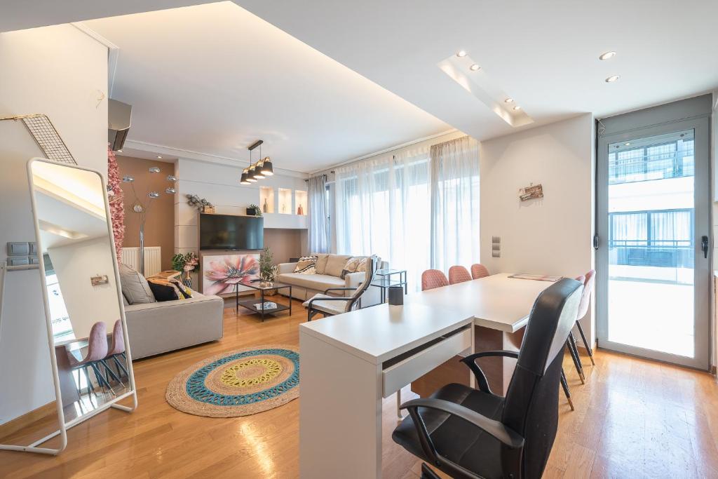 a living room with a table and chairs at The Luxury Loft by Cloudkeys in Athens
