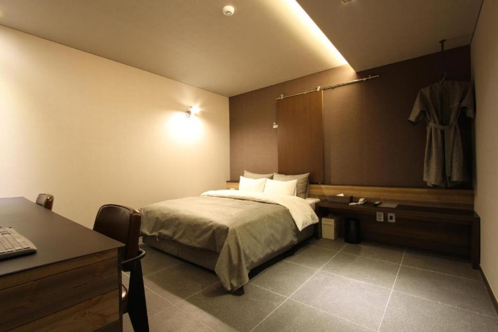 Postel nebo postele na pokoji v ubytování Boutique Hotel K-Oido