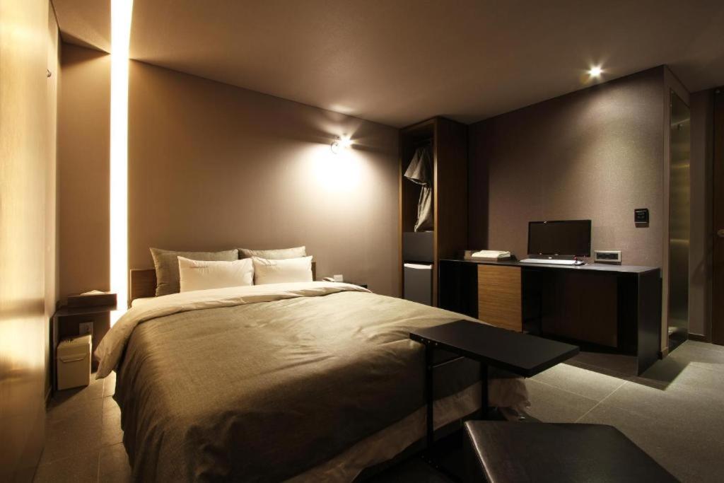 Postel nebo postele na pokoji v ubytování Boutique Hotel K-Oido