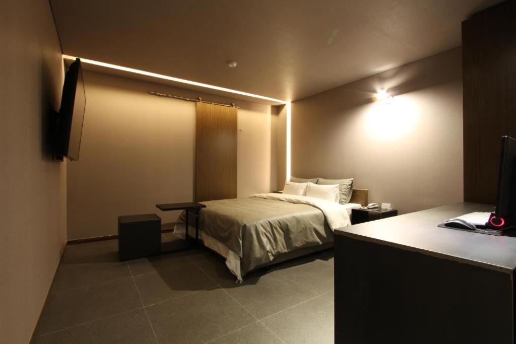 Postel nebo postele na pokoji v ubytování Boutique Hotel K-Oido