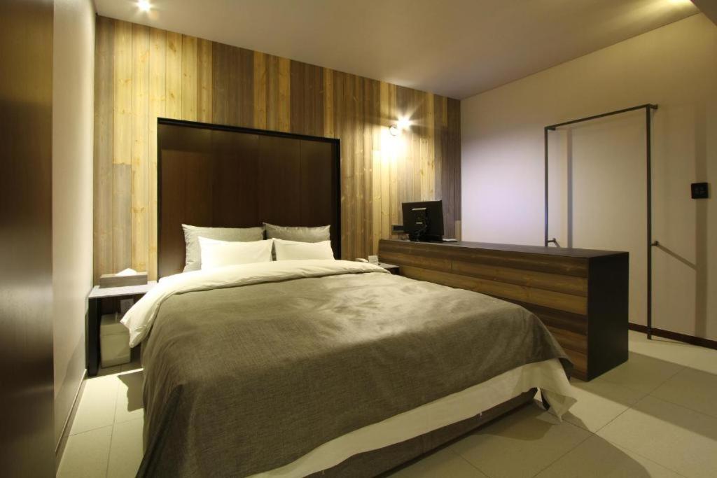 Postel nebo postele na pokoji v ubytování Boutique Hotel K-Oido
