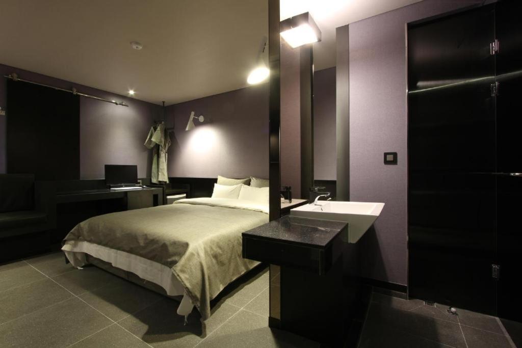 Postel nebo postele na pokoji v ubytování Boutique Hotel K-Oido