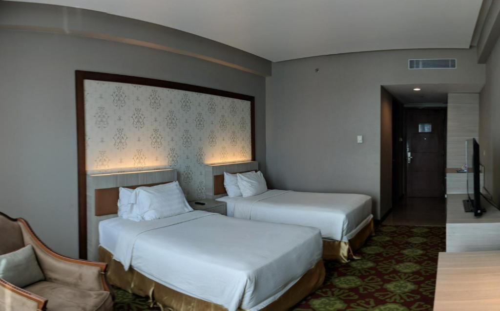 Postel nebo postele na pokoji v ubytování Five Premiere Hotel