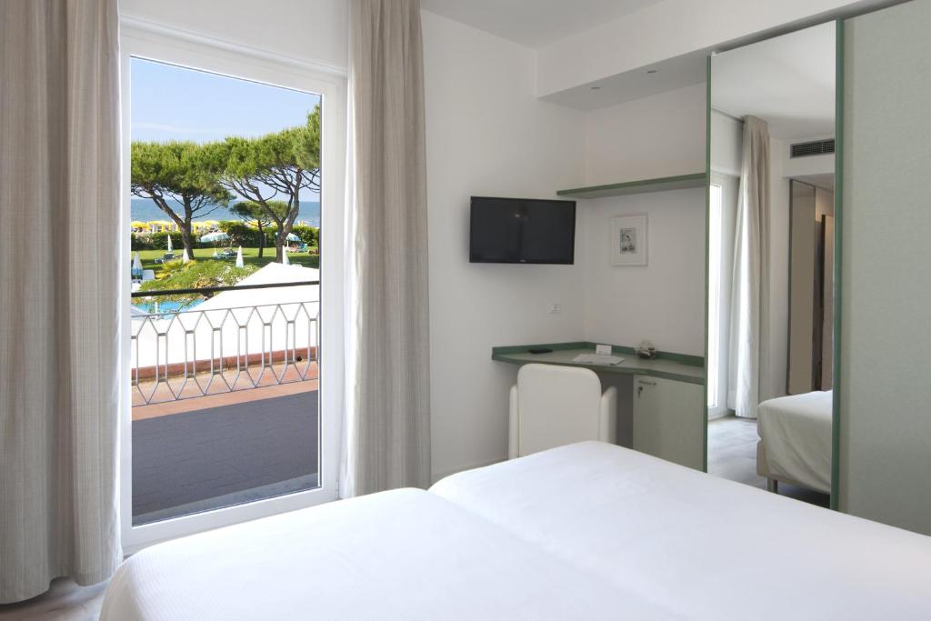 Postel nebo postele na pokoji v ubytování Hotel Bauer & Sporting