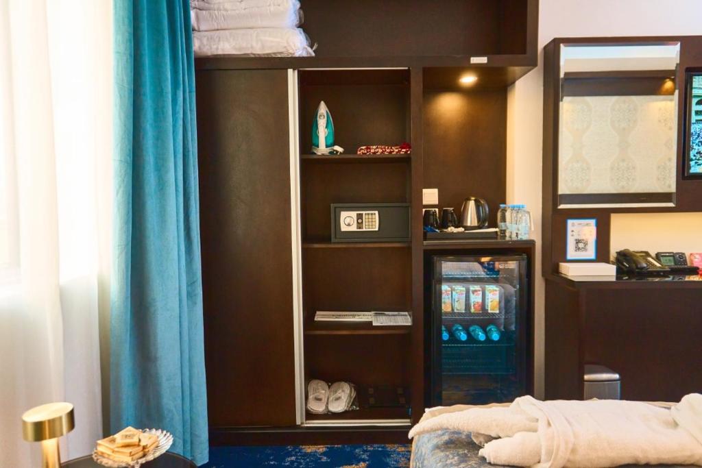 Postel nebo postele na pokoji v ubytování Selat Al Bait Hotel