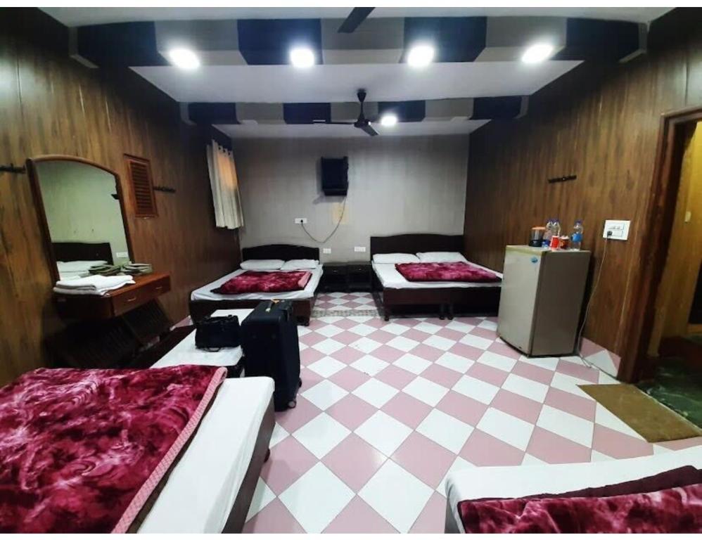 Voodi või voodid majutusasutuse Virasat Haweli, Mannavala, Punjab toas