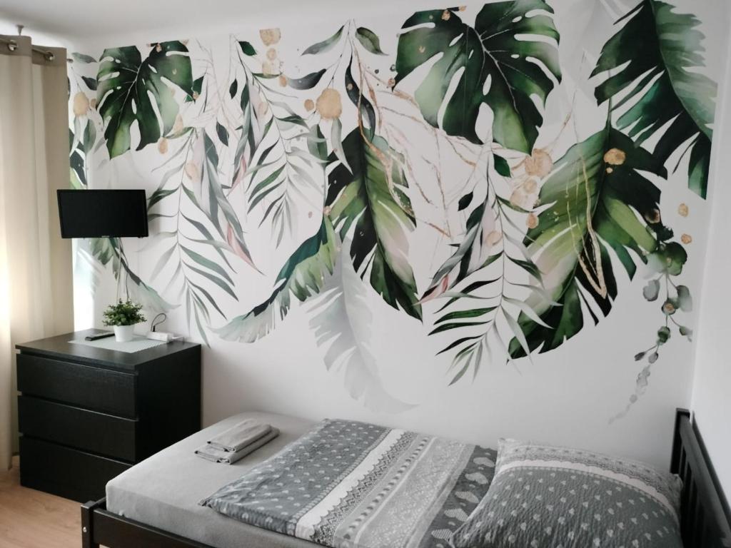 Posteľ alebo postele v izbe v ubytovaní Apartamenty Częstochowa