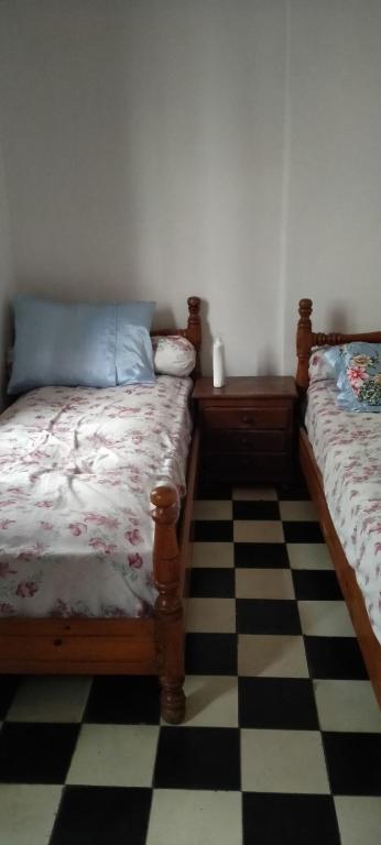 Postel nebo postele na pokoji v ubytování L'Oa